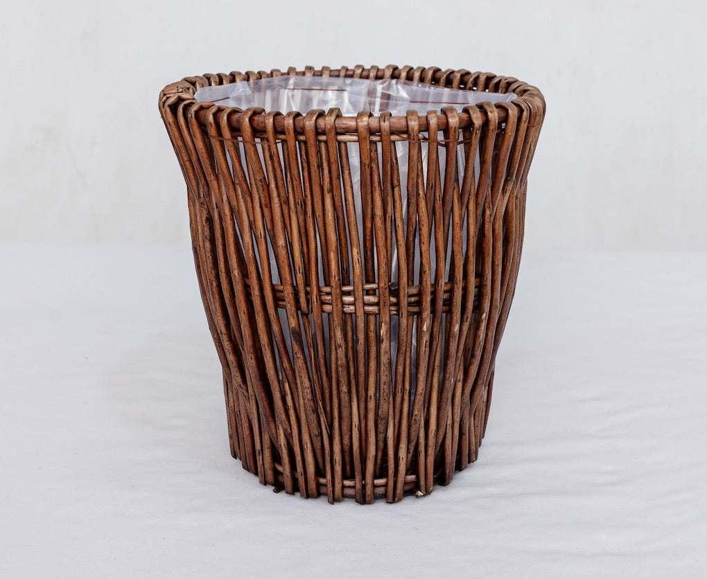 Handwoven willow planter basket in Brown with a plastic liner, 10 in top opening