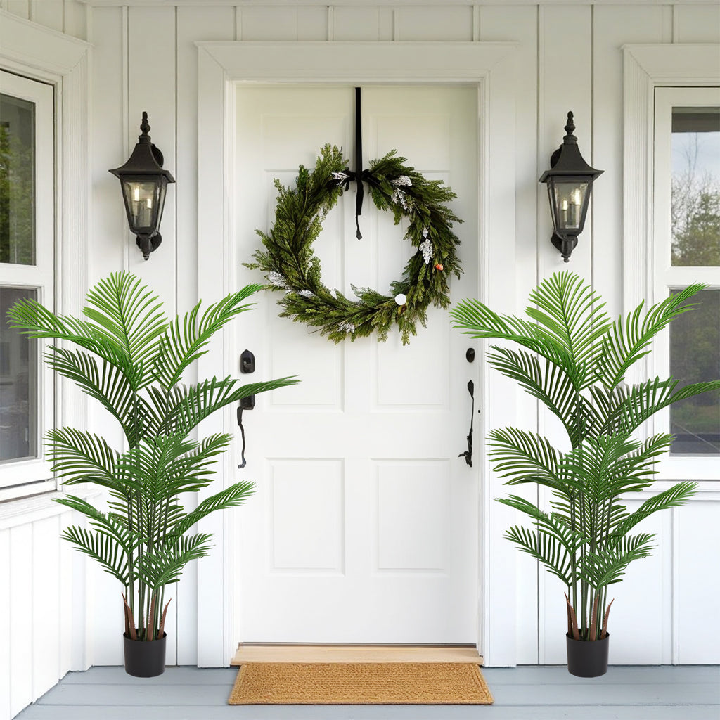 Photo of the faux areca palms, set of 2