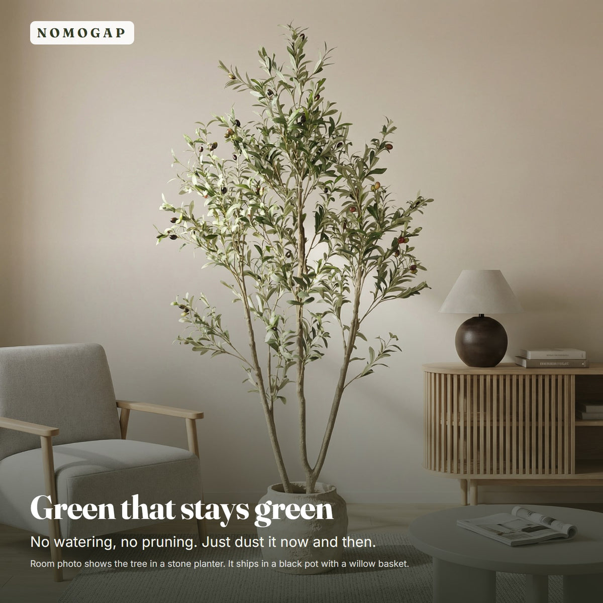 Faux olive tree in a living room beside an armchair, shown in a stone planter that is not included