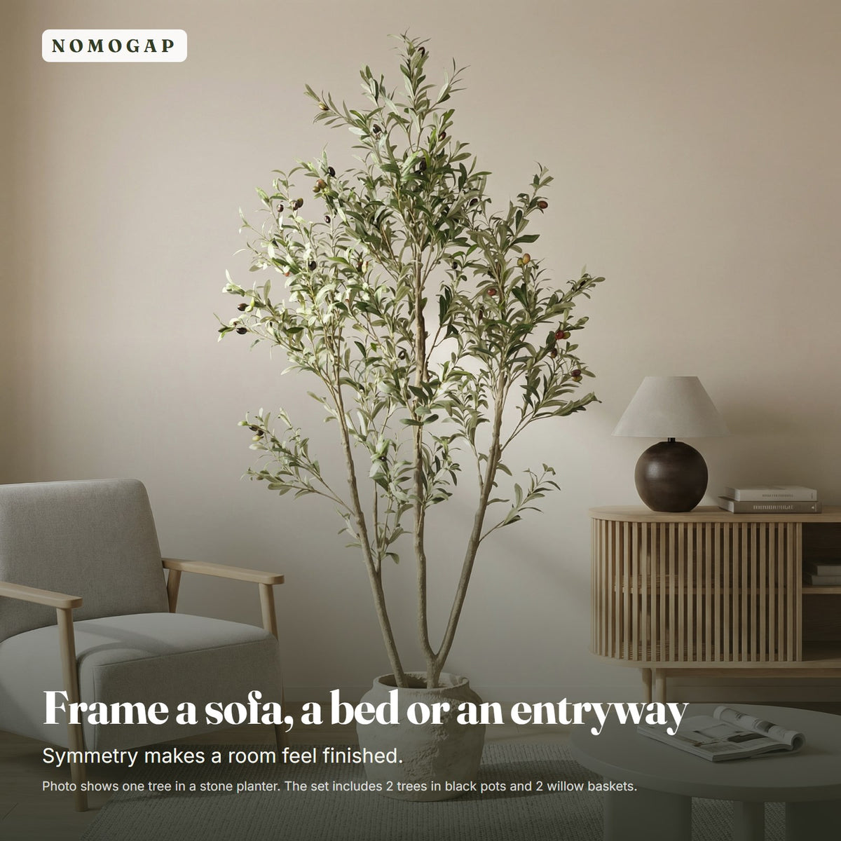 Faux olive tree in a living room beside an armchair, shown in a stone planter that is not included
